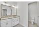 Well-lit bathroom with a double sink vanity and modern design at 116 Via Roma, Woodstock, GA 30188