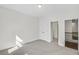 Bright bedroom with neutral carpet and trim and access to additional rooms at 116 Via Roma, Woodstock, GA 30188