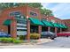 Commercial property with visible signage and well-maintained landscaping, providing a professional business environment at 116 Via Roma, Woodstock, GA 30188