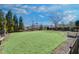 Expansive green common area with seating and manicured landscaping at 116 Via Roma, Woodstock, GA 30188