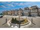 Upscale neighborhood entrance featuring a fountain and nicely kept landscaping at 116 Via Roma, Woodstock, GA 30188