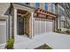 Welcoming entryway featuring stone accents, an attached garage, and manicured landscaping at 116 Via Roma, Woodstock, GA 30188