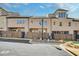 Rear exterior of townhomes with fenced in backyards at 116 Via Roma, Woodstock, GA 30188