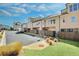 Back exterior view highlighting the architecture and outdoor spaces of these townhomes at 116 Via Roma, Woodstock, GA 30188