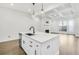 Beautiful kitchen with a large island, stainless dishwasher, and an open layout with fireplace at 116 Via Roma, Woodstock, GA 30188