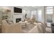 Staged living room shows fireplace, TV, furniture and open floor plan, bright and airy at 116 Via Roma, Woodstock, GA 30188
