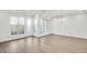 Spacious living room offers bright light, with multiple windows and a glass panel back door at 116 Via Roma, Woodstock, GA 30188