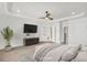 Large main bedroom with tray ceilings and a doorway to the ensuite at 116 Via Roma, Woodstock, GA 30188