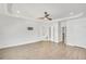 Spacious main bedroom with wood floors, tray ceilings, and ensuite bath at 116 Via Roma, Woodstock, GA 30188