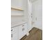 Mudroom with custom storage cabinets, quartz countertop, and built-in bench for convenience at 116 Via Roma, Woodstock, GA 30188