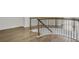 Curved staircase featuring wood and iron, with hardwood flooring at 116 Via Roma, Woodstock, GA 30188