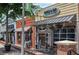 Truck & Tap storefront with brick facade and outdoor seating at 116 Via Roma, Woodstock, GA 30188
