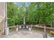 Outdoor deck with a seating area offering a serene view of the surrounding trees and nature at 227 Cedarhurst Dr, Canton, GA 30115