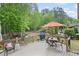Relaxing back deck and view of the fenced in backyard with mature trees create an inviting retreat at 227 Cedarhurst Dr, Canton, GA 30115