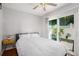 Bright bedroom featuring a sliding glass door with outdoor access and a ceiling fan at 2716 Suwanee Se Way, Marietta, GA 30067