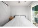 Clean bedroom featuring a sliding barn door, simple decor, and natural light from a window at 2716 Suwanee Se Way, Marietta, GA 30067