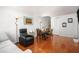 Bright living room with hardwood floors, a dining area, and a comfortable seating arrangement at 2716 Suwanee Se Way, Marietta, GA 30067
