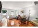 Open-concept living room featuring hardwood floors, neutral-toned furniture, and a dining area at 2716 Suwanee Se Way, Marietta, GA 30067