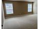 Spacious bedroom with neutral carpet and large windows providing natural light at 3648 Lake Estates Way, Atlanta, GA 30349