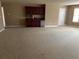Large bonus room featuring neutral carpet, a wet bar, and a window at 3648 Lake Estates Way, Atlanta, GA 30349
