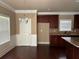 Bright breakfast nook features hardwood flooring, dark wood cabinetry, and natural light at 3648 Lake Estates Way, Atlanta, GA 30349