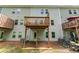 View of backyard of townhome with decks on multiple levels, and a patio area underneath one of them at 6237 Thorncrest Dr # 10, Tucker, GA 30084