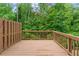 Wooden deck overlooking a lush green backyard with mature trees at 6237 Thorncrest Dr # 10, Tucker, GA 30084