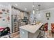 This kitchen features an island with a sink, stainless steel appliances, and pendant lights at 6237 Thorncrest Dr # 10, Tucker, GA 30084