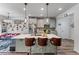 Modern kitchen featuring a quartz-topped island with bar stools, stainless steel appliances, and sleek gray cabinetry at 6237 Thorncrest Dr # 10, Tucker, GA 30084