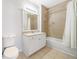 Classic bathroom with single vanity, tub/shower combo, and neutral tile at 10 Perimeter Summit Ne Blvd # 3109, Atlanta, GA 30319