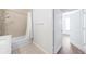 Bathroom with tile floors, tub/shower, and doorway to the bedroom at 10 Perimeter Summit Ne Blvd # 3109, Atlanta, GA 30319