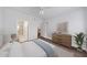 A bedroom with a dresser, bed, and hardwood floors provides a cozy space at 10 Perimeter Summit Ne Blvd # 3109, Atlanta, GA 30319