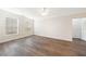 Bedroom featuring wood floors, two windows, a ceiling fan, and a closet with double doors at 10 Perimeter Summit Ne Blvd # 3109, Atlanta, GA 30319