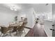 Bright dining area with stylish lighting and hardwood floors leading to a spacious living room at 10 Perimeter Summit Ne Blvd # 3109, Atlanta, GA 30319