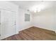 Clean, vacant room featuring hardwood floors, a neutral color palette, and a glass block window at 10 Perimeter Summit Ne Blvd # 3109, Atlanta, GA 30319