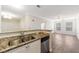 Modern kitchen with granite counters, stainless appliances, and an open view to the living area at 10 Perimeter Summit Ne Blvd # 3109, Atlanta, GA 30319