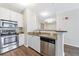 Updated kitchen with stainless steel appliances, a stylish backsplash, and modern finishes at 10 Perimeter Summit Ne Blvd # 3109, Atlanta, GA 30319