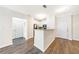 Well-lit kitchen with white cabinets, a breakfast bar, and seamless flow into adjacent living spaces at 10 Perimeter Summit Ne Blvd # 3109, Atlanta, GA 30319
