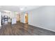Living area with a view of the kitchen and bathroom, featuring wood flooring and neutral walls at 10 Perimeter Summit Ne Blvd # 3109, Atlanta, GA 30319
