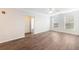 Bright living room with ceiling fan, wood floors, and natural light from two large windows at 10 Perimeter Summit Ne Blvd # 3109, Atlanta, GA 30319