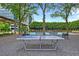Outdoor ping pong table surrounded by lush greenery and lounge areas for recreation at 10 Perimeter Summit Ne Blvd # 3109, Atlanta, GA 30319