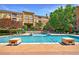 Inviting community pool area with ample lounge chairs, umbrellas, and manicured landscaping at 10 Perimeter Summit Ne Blvd # 3109, Atlanta, GA 30319