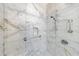 Shower with marble tile, grab bar, and built-in niche; accessible design at 10 Perimeter Summit Ne Blvd # 3109, Atlanta, GA 30319