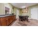 Carpeted living room boasts a wet bar, card table, and accent lighting fixture at 10 Perimeter Summit Ne Blvd # 3109, Brookhaven, GA 30319