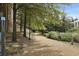 Scenic walking trail surrounded by lush greenery and mature trees, perfect for an evening stroll at 10 Perimeter Summit Ne Blvd # 3109, Brookhaven, GA 30319