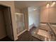 Well-lit bathroom with granite countertops, double sinks, a glass-enclosed shower, and a separate soaking tub at 2285 Crossrail Dr, Atlanta, GA 30349