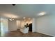 Spacious living room featuring hardwood floors, recessed lighting, and an open floor plan connected to the kitchen with an island at 2285 Crossrail Dr, Atlanta, GA 30349