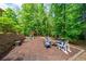 Backyard with playground, seating area and a fire pit, providing a relaxing space for Gathering enjoyment at 4281 Chimney Lake Ne Dr, Roswell, GA 30075