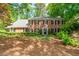 Charming two-story brick home with a well-maintained lawn and mature trees in a desirable neighborhood at 4281 Chimney Lake Ne Dr, Roswell, GA 30075