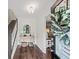 Bright foyer with dark hardwood floors, staircase, and a view to the living room at 4281 Chimney Lake Ne Dr, Roswell, GA 30075
